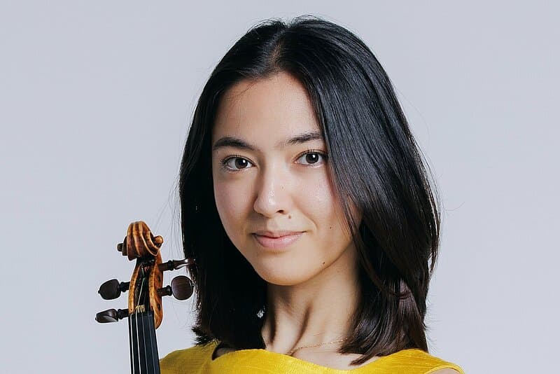 Violinist Gina Keiko Friesicke with her instrument
