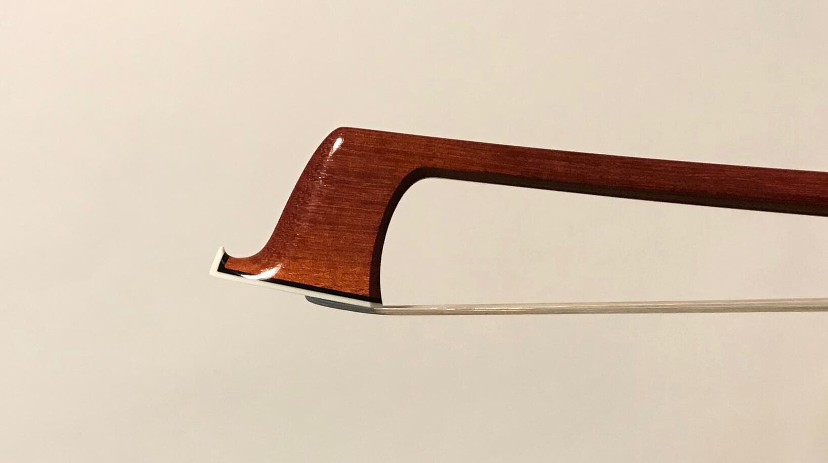 Head of a violin bow by Cody Kowalski