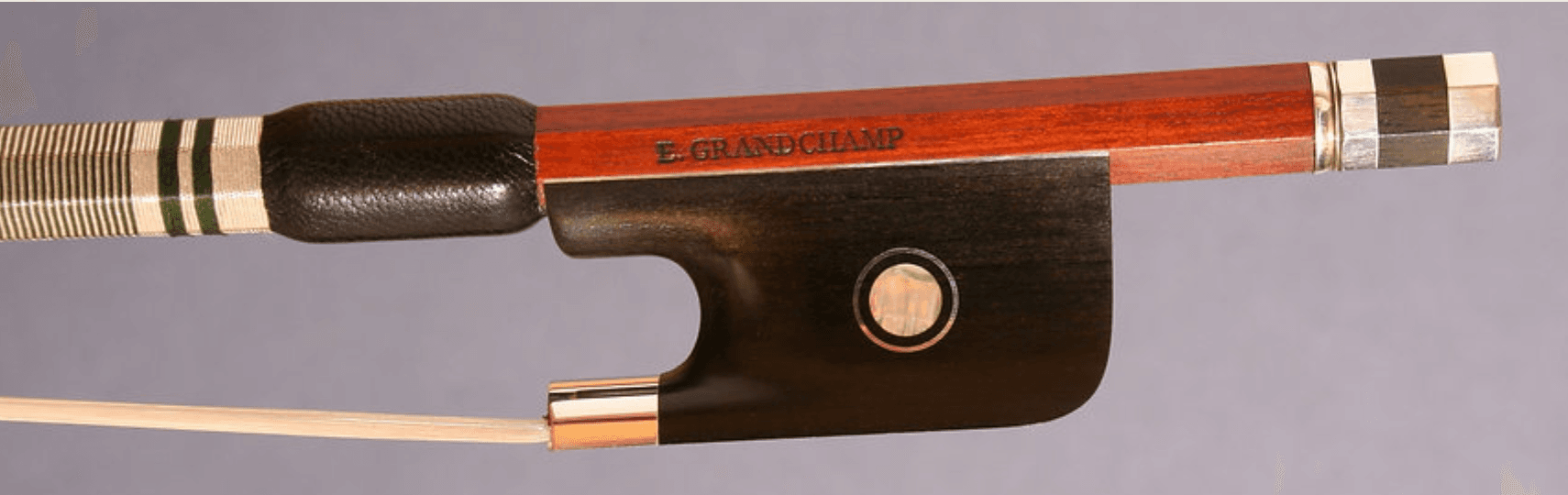 Bow frog stamped E. Grandchamp, with mother of pearl eye